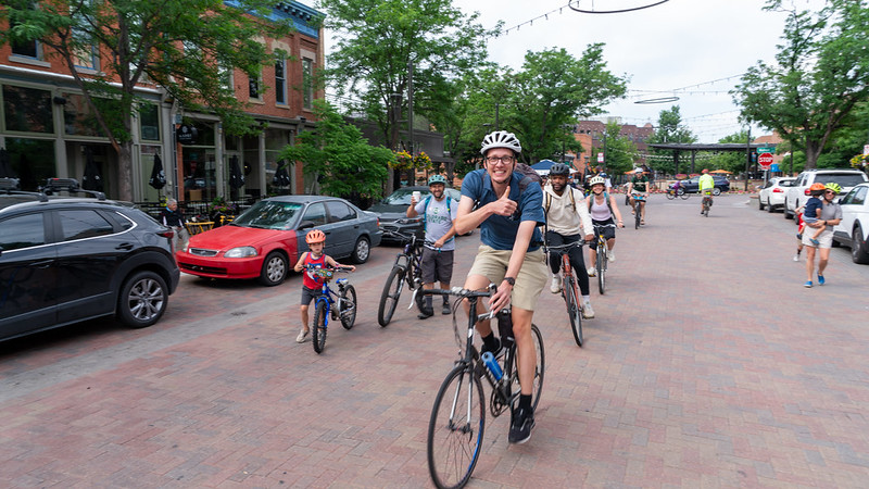 People riding their bicycles in Downtown Fort Collins