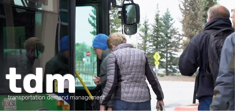 Picture of people boarding a bus with Transportation Demand Management